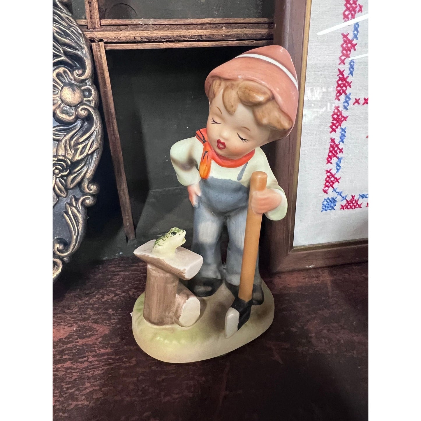 Ceramic boy chopping wood figurine